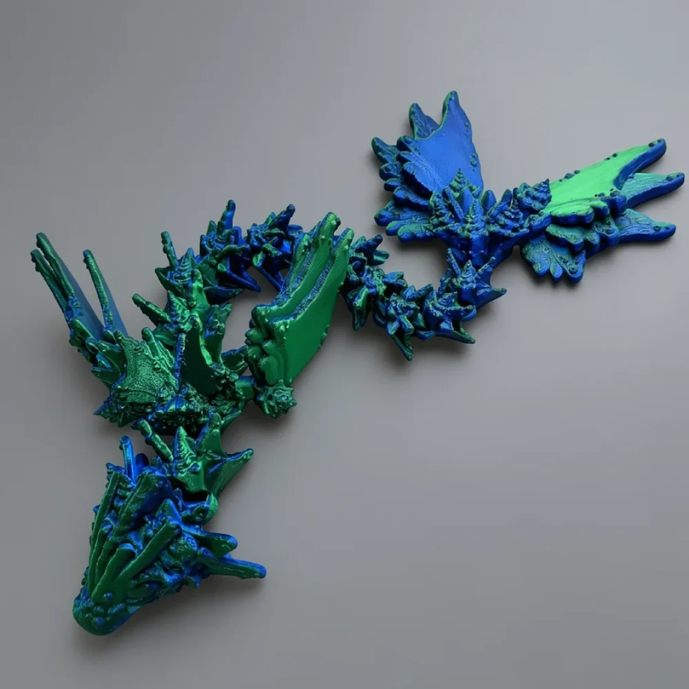 Baby Ocean Serpent Dragon: royal blue and emerald green abstract stylized dragon figurine