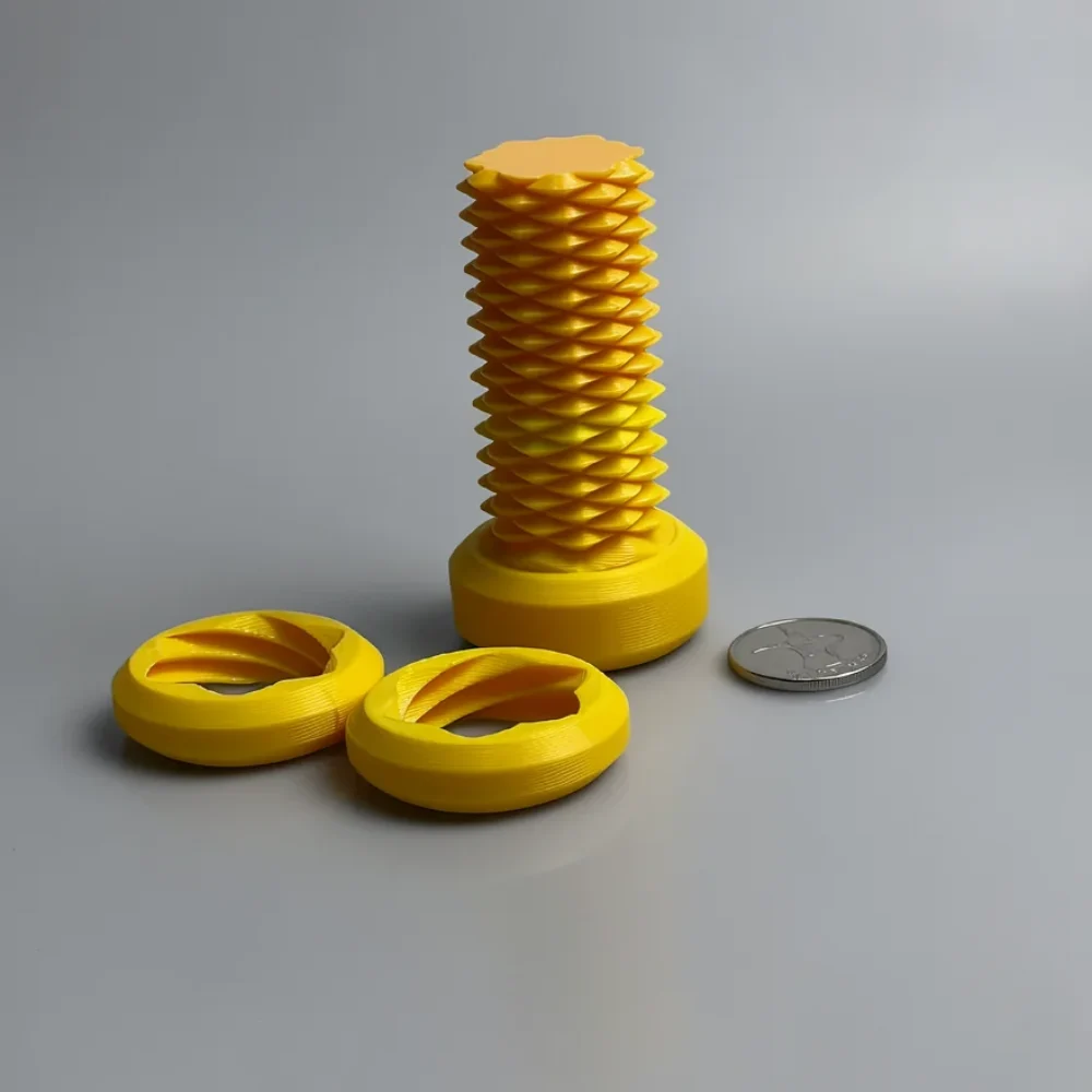 Two Way Screw – 7.5cm: yellow loose set of three geometric printed pieces - one tall coiled lattice column on a disc with a…