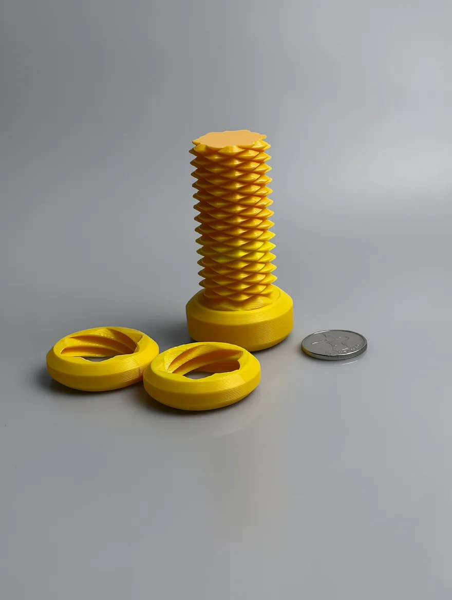 Two Way Screw – 7.5cm: yellow loose set of three geometric printed pieces - one tall coiled lattice column on a disc with a…