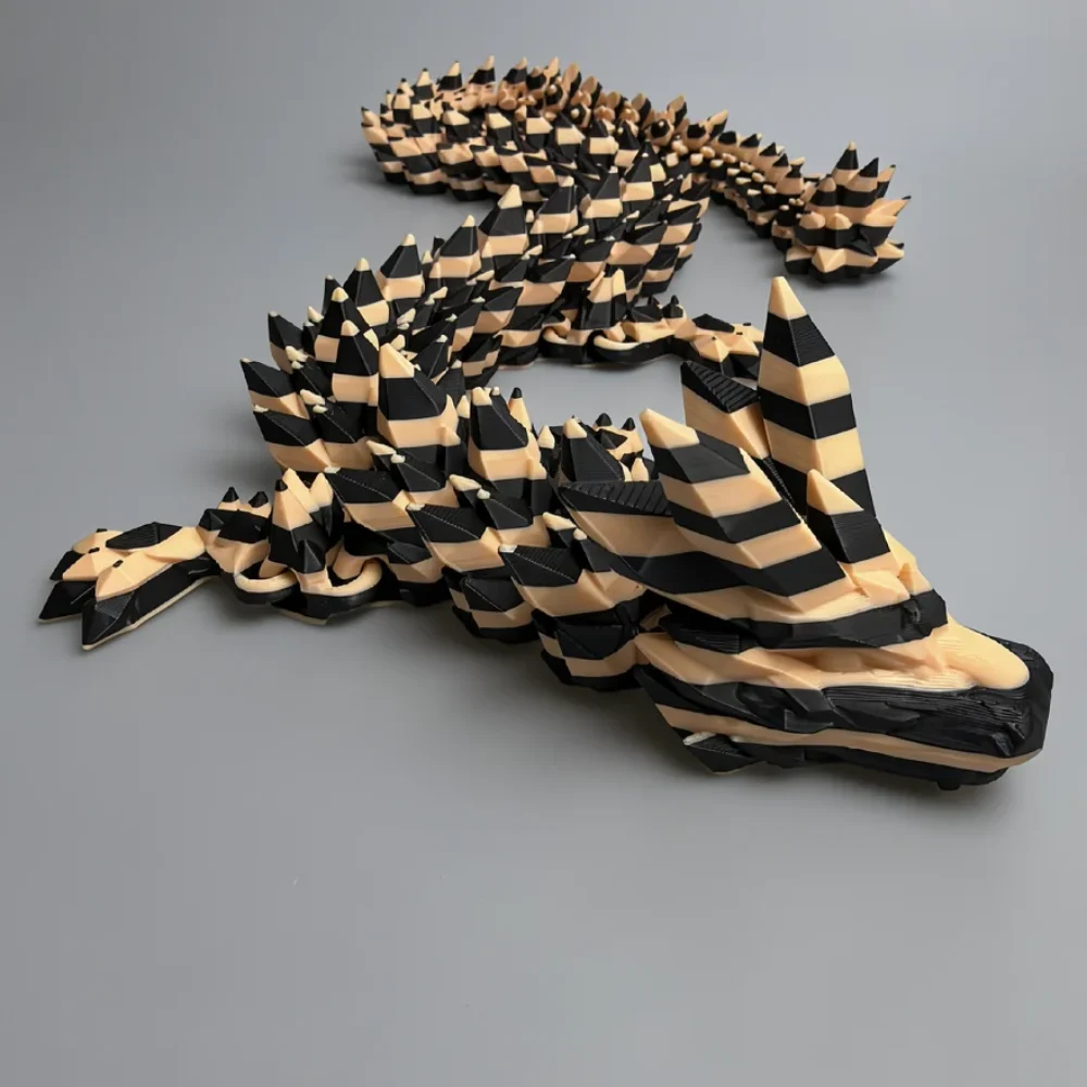 Crystal Dragon: black and cream articulated flexi dragon figurine, articulated segmented body with gaps between segments