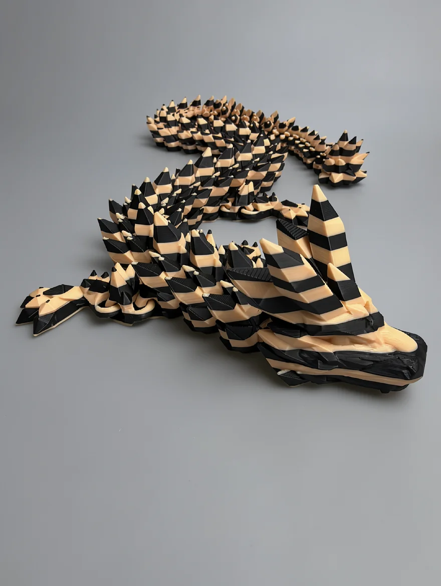 Crystal Dragon: black and cream articulated flexi dragon figurine, articulated segmented body with gaps between segments