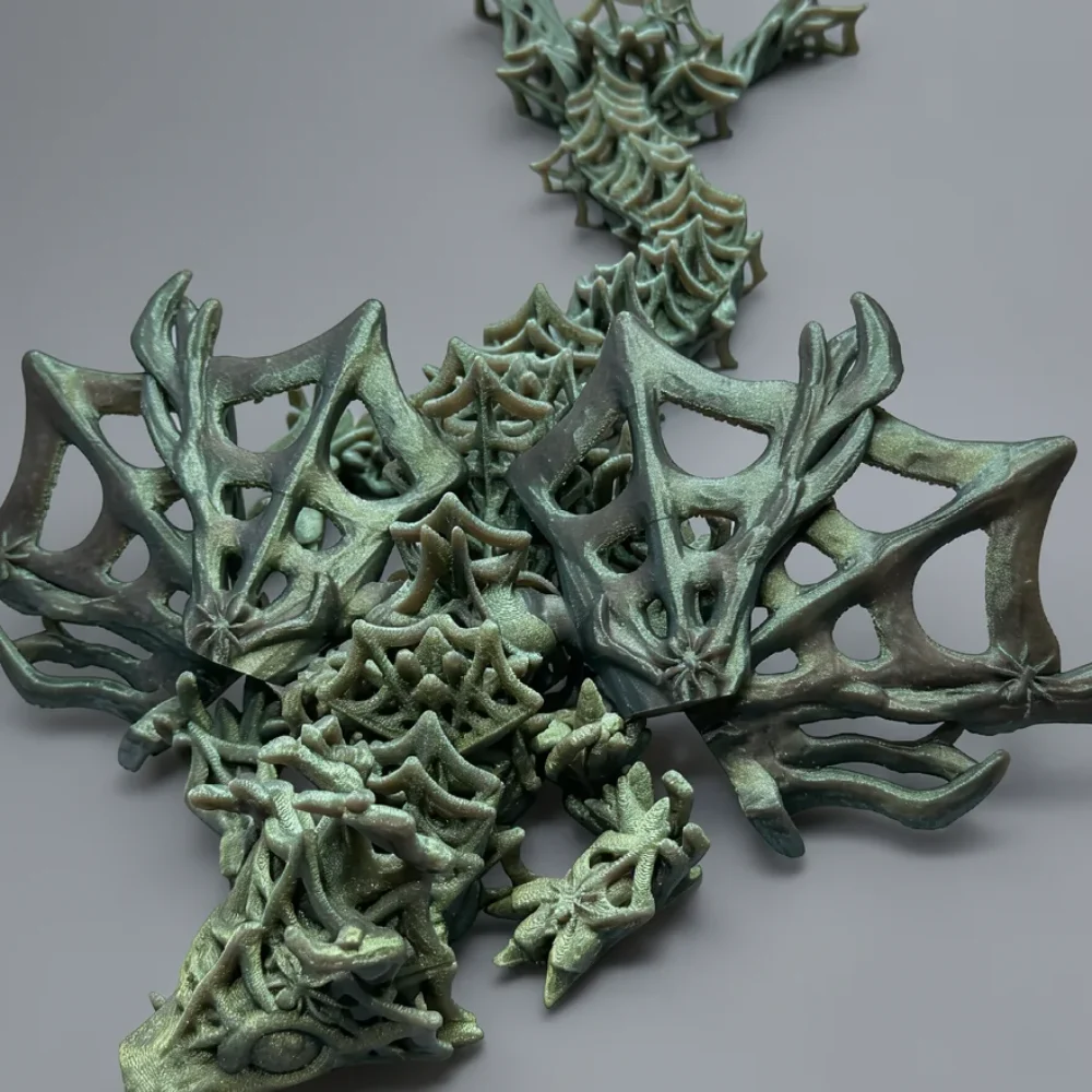 Baby Wickedwing Dragon: sea-foam green and teal lattice dragon figurine, intricate geometric lattice wireframe structure