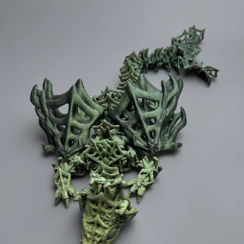 Baby Wickedwing Dragon: muted green and dark green lattice-work dragon figurine, voronoi lattice structure throughout body