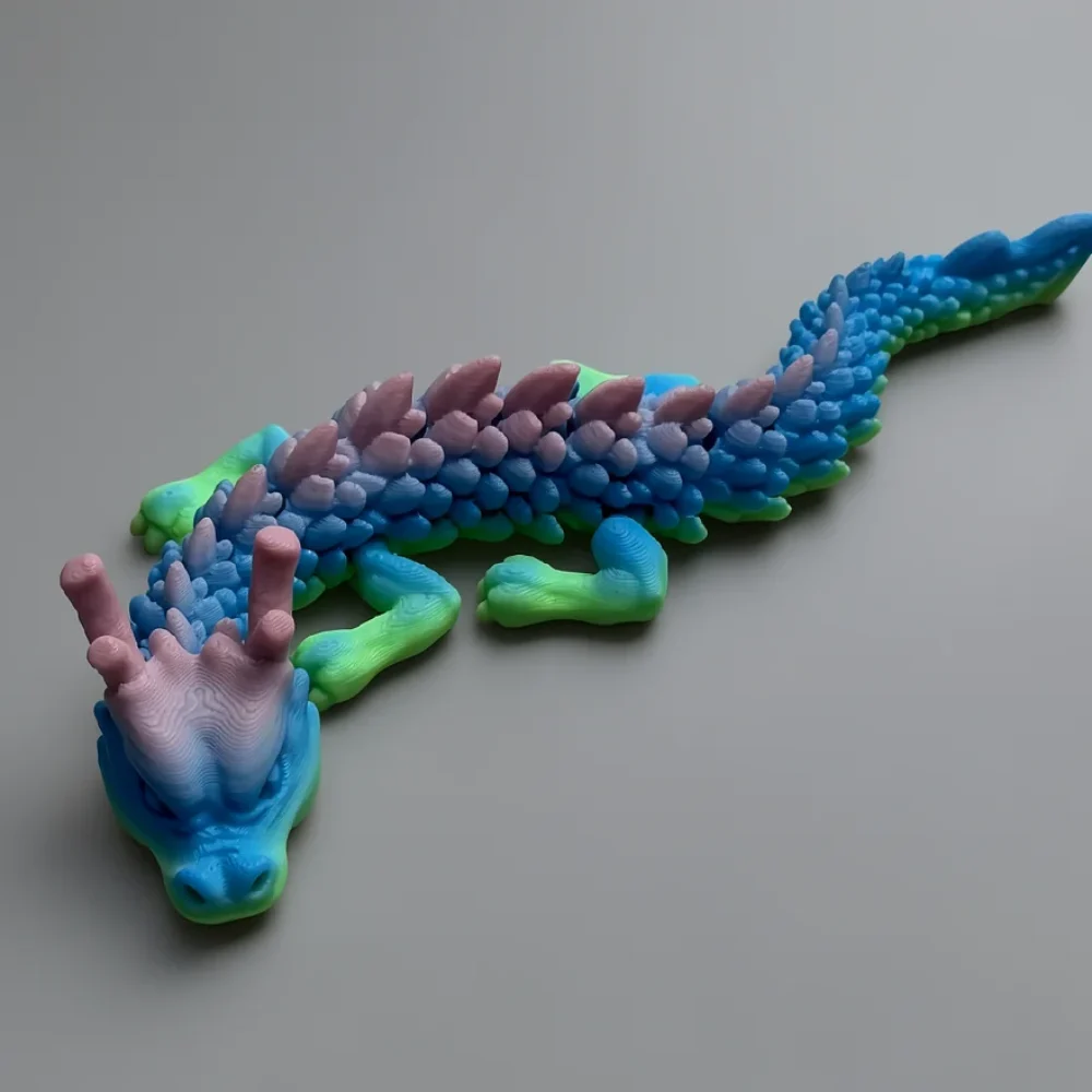Jr Chinese Dragon: pink lavender and light blue dragon figurine, two long forward-curving horns on crown of head
