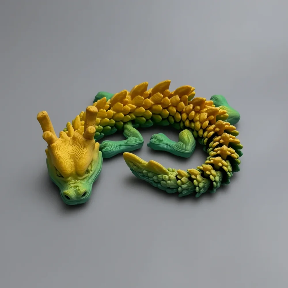 Jr Chinese Dragon: yellow and green dragon figurine, three short horns on top of head