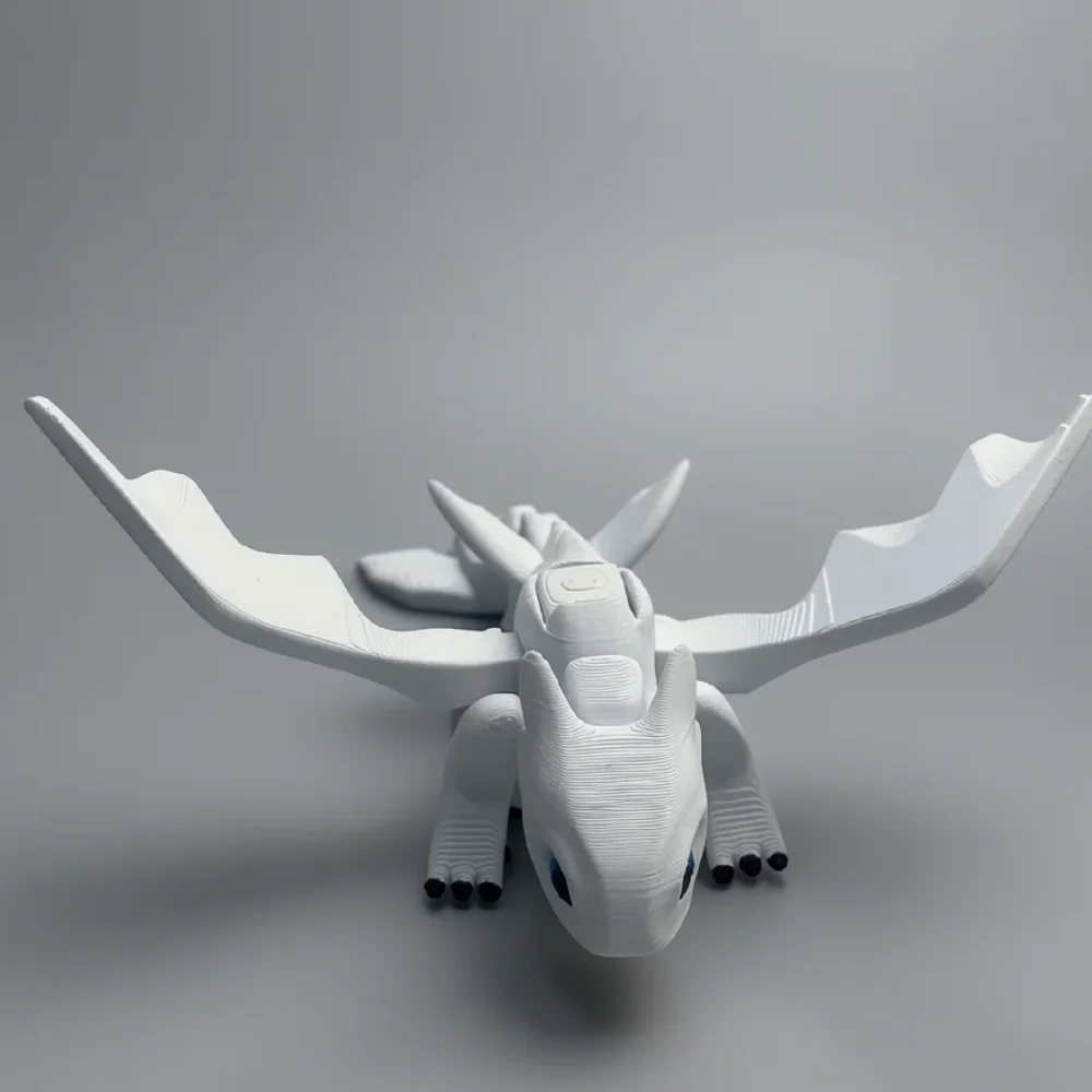 Light Fury: white and black dragon figurine, pointed aerodynamic snout