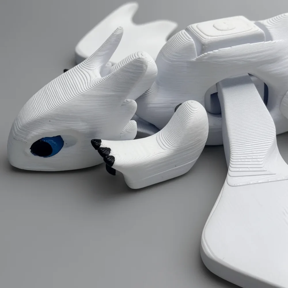 Light Fury: white and blue dragon figurine, two curved horns on head