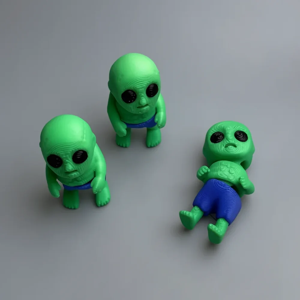 Tiny Zombie: green and blue set of three small alien/zombie baby figurines, large bulbous head with wrinkled forehead