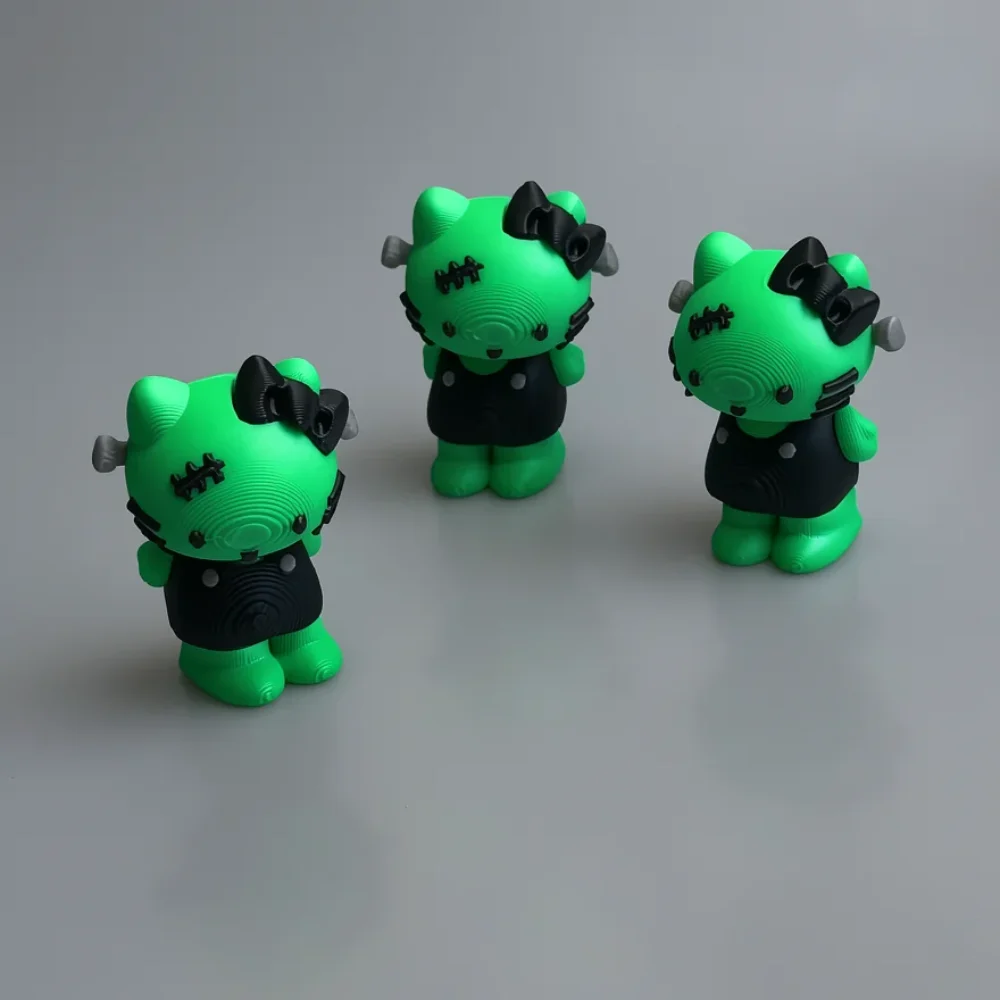 Frankenstein Hello Kitty: lime green and black Hello Kitty Frankenstein gothic figurine, black stitch markings on forehead