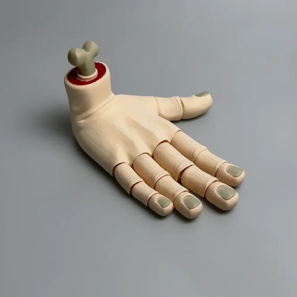 Hand (Right): cream / off-white and red articulated severed-foot figurine