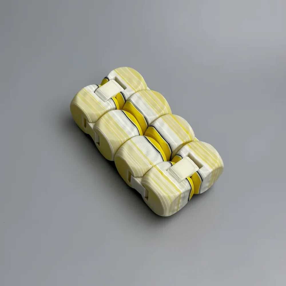 Infinity Cube: pale yellow (cream) and off-white segmented capsule cluster